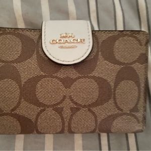 Coach white and tan envelope wallet used once